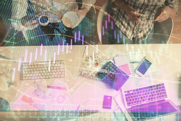 Double exposure of man and woman working together and financial chart hologram drawing. market...