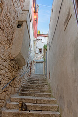 Scene of a cobblestoned street in the historic center of Rovinj in Croatia during sunrise