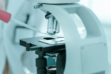 close up. scientist using automatic pipette for research .