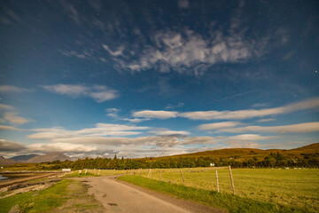 night shot of the stars and Milky Way above rannoch moor, glen etive and Glencoe in the argyll region of the highlands of Scotland during a clear bright night in autumn