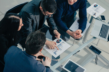 close up. business colleagues sitting at the office Desk.