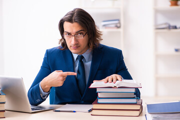 Young businessman student studying at workplace