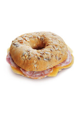 A tasty bagel with salami, cheese and seeds, isolated