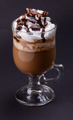 a glass of coffee with cream