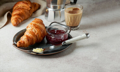 croissants with coffee and jam, tipical cotinental breakfast