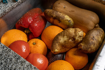 Clean fruits and vegetables in the kitchen