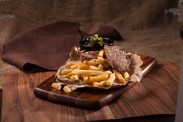 french fries with meat and salsa sauce