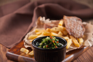 french fries with meat and salsa sauce