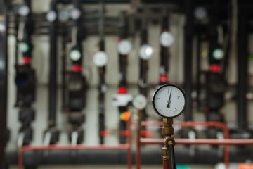 Pressure gauges in the cooling engine room, shallow depth of field.