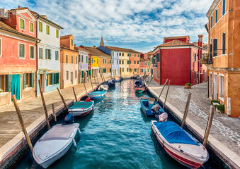 Fototapeta na wymiar Colorful houses along the canal, island of Burano, Venice, Italy