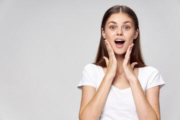 Fototapeta premium woman with open mouth surprised look white t-shirt 