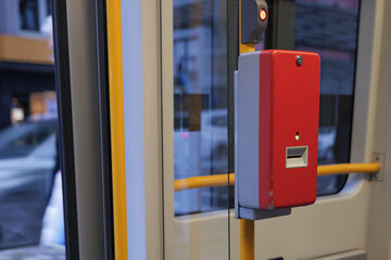 Selected focus at Red public transportation ticket stamp or validation ticket machine beside...