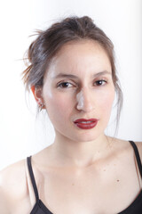 A young woman portrait with red lips in studio