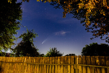 comet over fence and stars