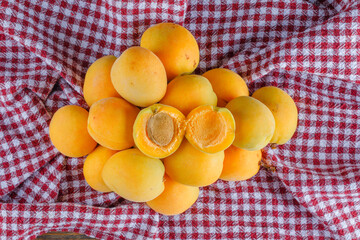 Apricots on a picnic cloth background. flat lay.
