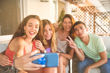 Happy Best Friends Taking Selfie on a Balcony. Happy Friends Concept Having fun Together
