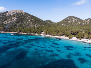 Obraz premium Aerial drone view, beautiful scenic landscape view of mountains and blue crystal clear water on the shore of Mallorca Island, Balearic Island, Spain