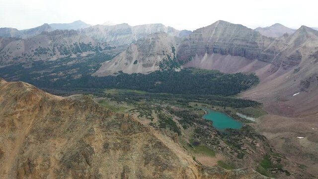 Aerial View of Amethyst Lake in Scenic Valley Under Uinta Mountains Range, Utah USA. Drone Shot