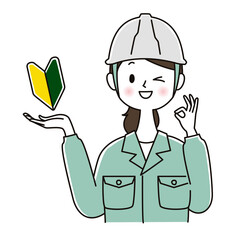 初心者OKサインを出す作業服の女性