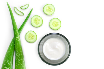 Aloe vera cosmetic skincare cream in glass jar, aloe gel with fresh green aloevera leaf and cucumber isolated on white background. Top view. Flat lay.
