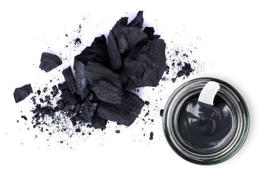 Activated Charcoal Powder And Clay Or Charcoal Mud Cream In Jar Isolated On White Background. Top View. Flat Lay. Beauty Spa, Skin Care, Natural Face Mask Concept.