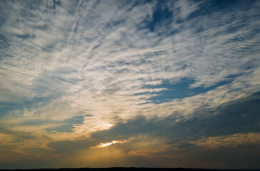 Fototapeta na wymiar Colorful dramatic sunrise with clouds sky bright horizon burning skies