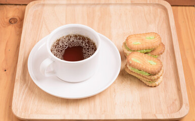 Coffee cup with the bread and put on the table.