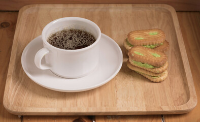 Coffee cup with the bread and put on the table.