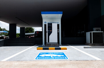 charging station for electric vehicle.outdoor car parking . blue sign EV quick charging point . - 382044792