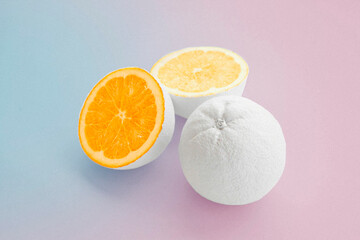 citrus orange painted white on pale pink and baby blue background 