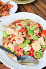 Stir-fried Stink Beans with shrimp in white plate