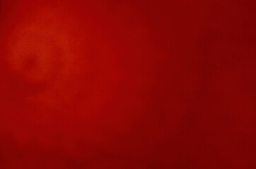 Abstract red background with gradient transitions and shadows.