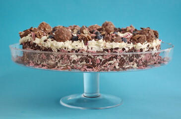 Closeup of chocolate cake against the blue background