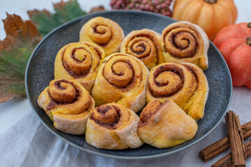 sweet home made autumn cinnamon rolls with pumpkin