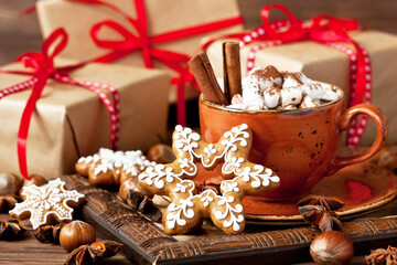 Cup of creamy hot chocolate with melted marshmallows and spices  for christmas holiday
