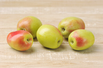 whole apples on wooden background -