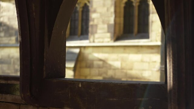 View of English church lych gate with stone built church background