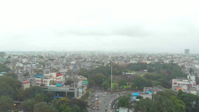 static drone shot over Shaniwar wada traffic Dr Hegdwar chowk old Pune city heritage site India