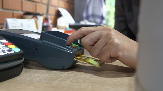 Customer using credit card for payment, credit card payment service.