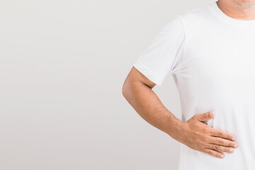 Liver or kidney problem concept : Man holding hand on belly and feeling a pain in liver or . Studio...