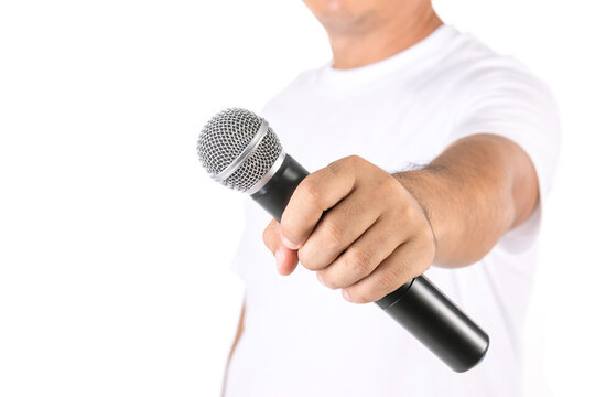 People holding black wireless microphone in studio. Isolated on white