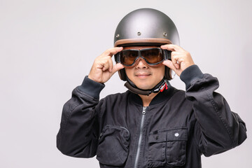 Motorcyclist or rider wearing vintage helmet. Safe ride campaign concept. Studio shot isolated on grey