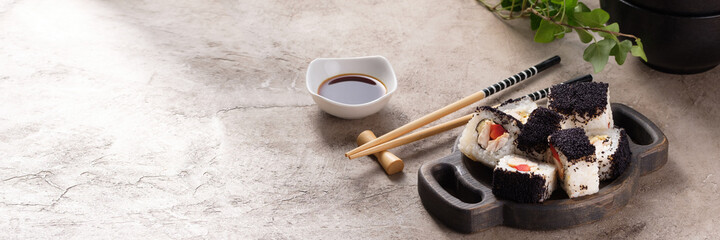 Japanese sushi food. Top view of sushi. Rolls with masaga caviar. Still life. Unusual composition of rolls.