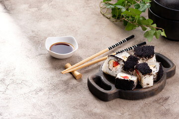 Japanese sushi food. Top view of sushi. Rolls with masaga caviar. Still life. Unusual composition of rolls.