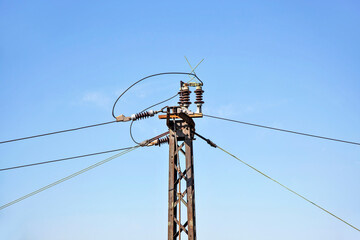 Electric wire. high voltage power line. Power electricity wires for trains against blue sky. 