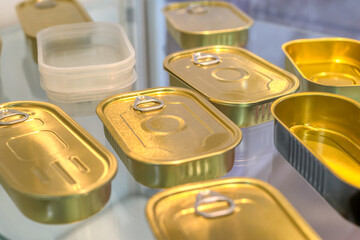 Lots of round cans. Banks have a key for opening manually