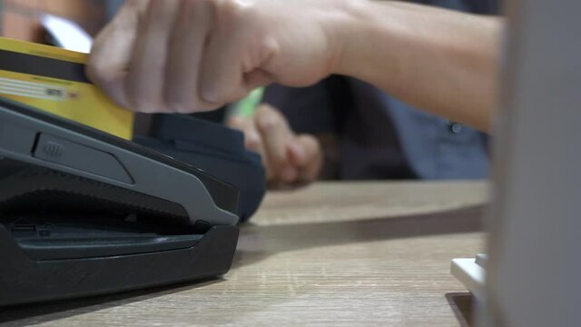 Customer using credit card for payment, credit card payment service.