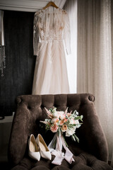 shoes of the bride with a wedding bouquet