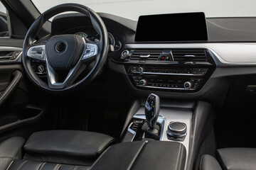 Modern suv car interior with leather panel, multimedia and dashboard