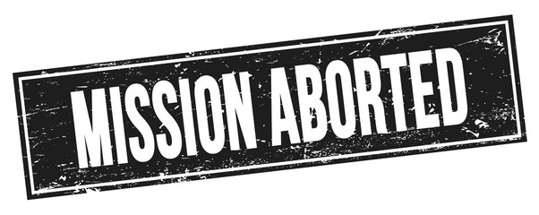 MISSION ABORTED text on black grungy rectangle stamp.